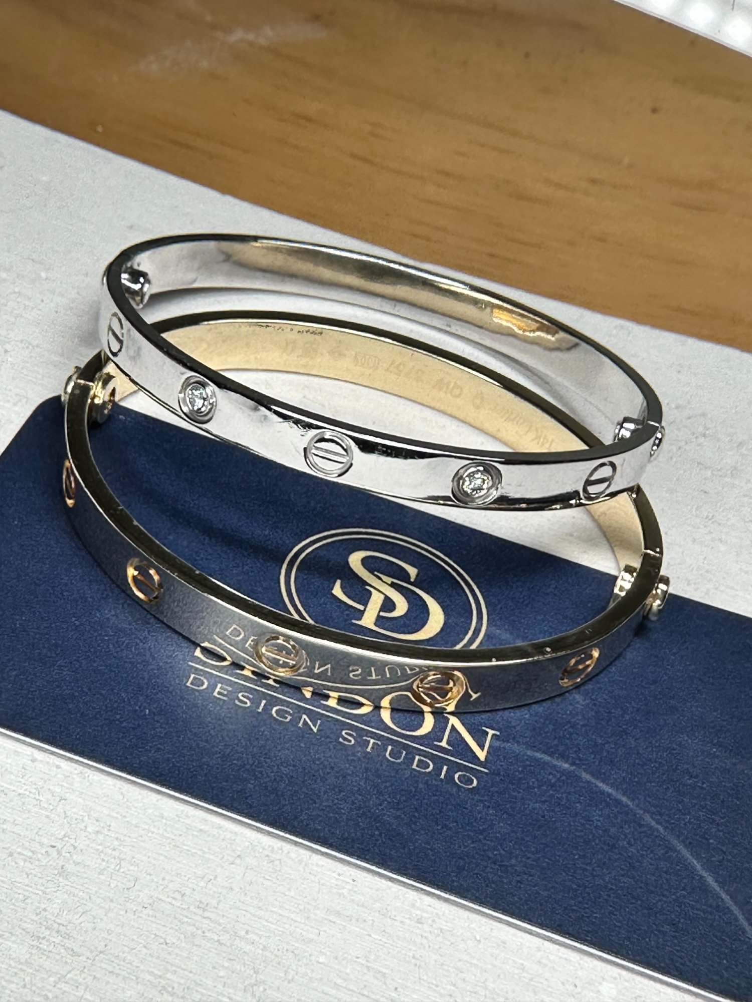 Gold bangle bracelets on Sindon display
