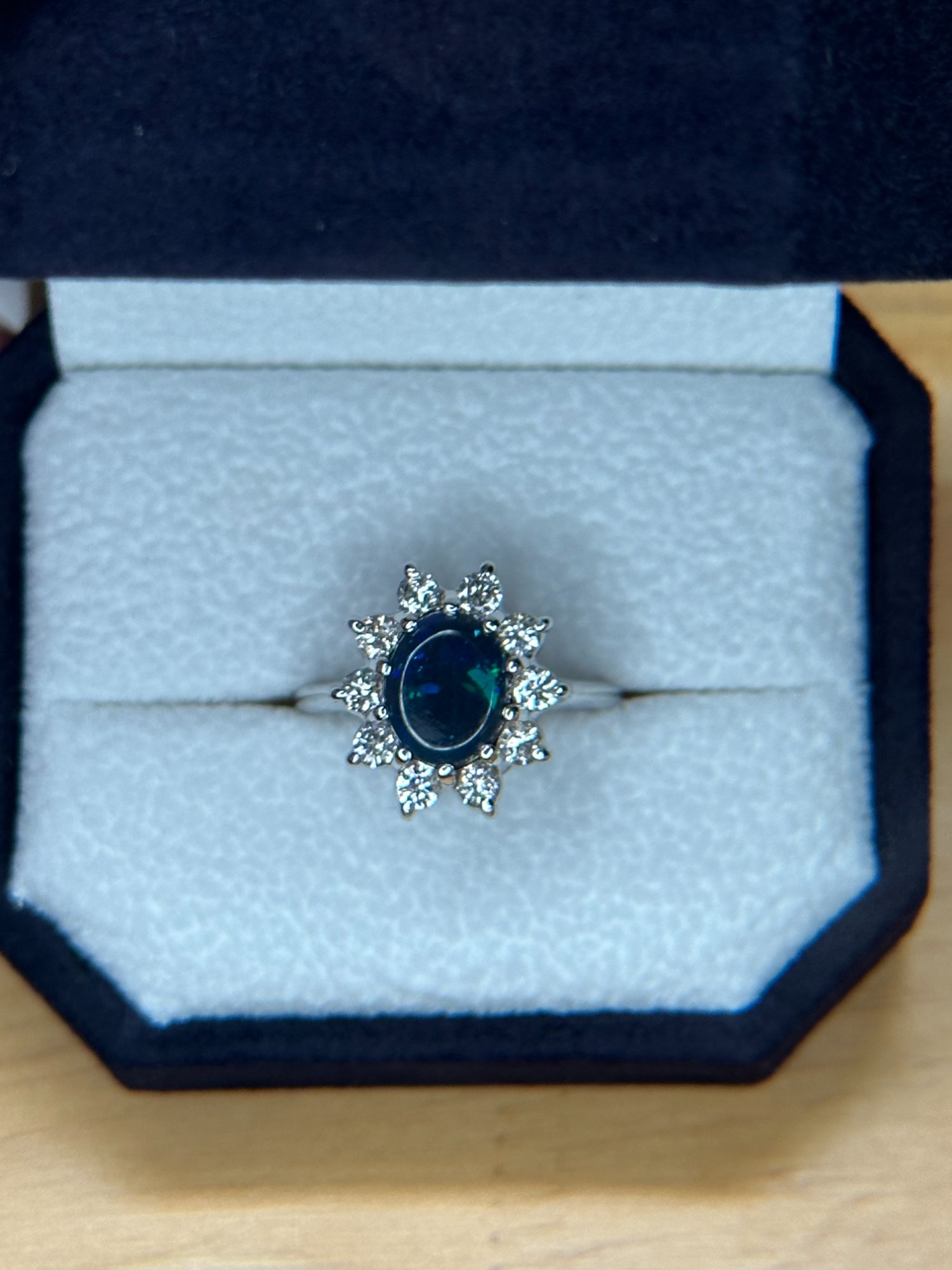 Opal and diamond halo ring